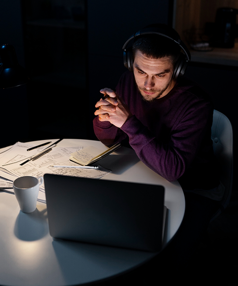 A close-up of the same man wearing headphones.